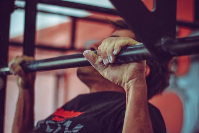 Closeup of man lifting weights