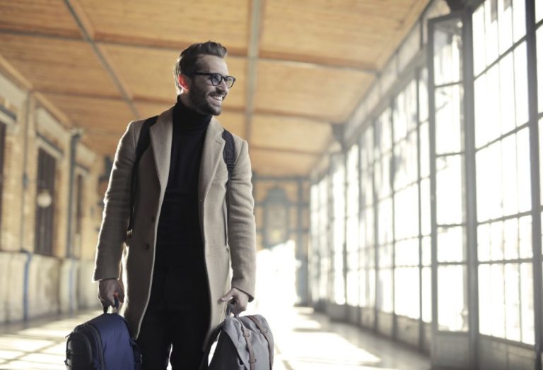 Man carrying two backpacks