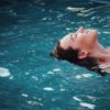 Woman floating on her back serenely in water